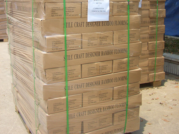 Professional film-wrapped bamboo flooring pallets ready for warehouse export