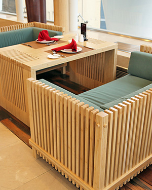 Custom bamboo furniture and slatted booth seating made from Bothbest bamboo panels